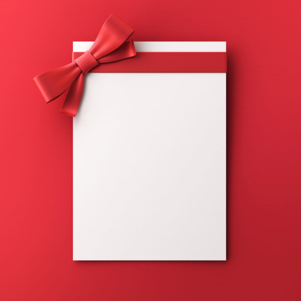 礼品卡与红色蝴蝶结在红色背景的股票照片图片下载