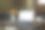 质朴的木桌上放着空空的笔记本电脑、一杯咖啡、书和插着黄花的花瓶。图片下载