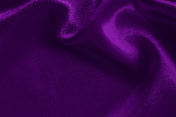 紫色织物织物纹理的背景和设计艺术作品，美丽的褶皱图案的丝绸或亚麻。图片下载