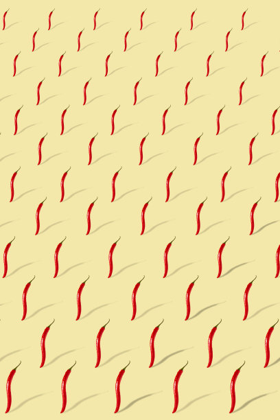 米色背景上有辣椒。辣椒图案。图片下载