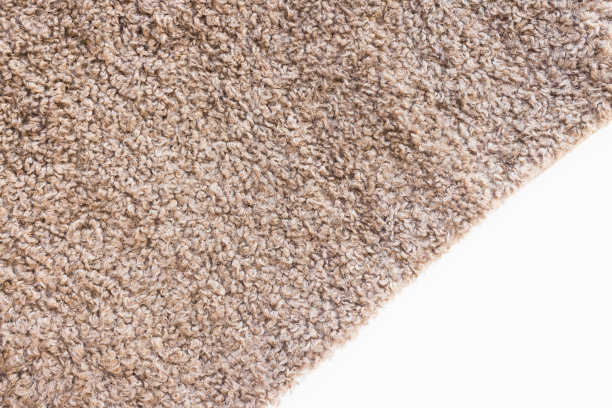 柔软的棕色卷毛泰迪毛绒扔或枕套。抽象织物纹理背景特写图片下载