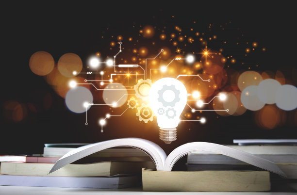 灯泡和书。观念读书、求知、求新。图片下载