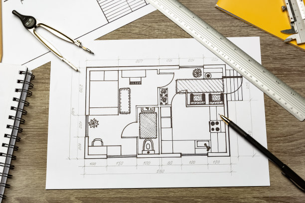 设计师在纸上画出了家庭内部的布局。房间的示意图。图片下载