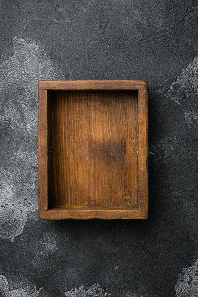 空木盒与复制空间的文字或食物，俯视图平铺，黑色深色的石头桌子背景图片下载