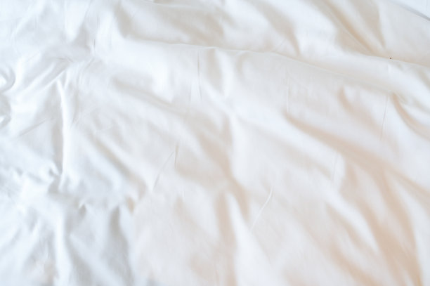 床上的白色毯子，织物的纹理图片下载