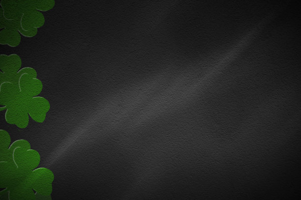 三叶草覆盖黑色背景。图片下载