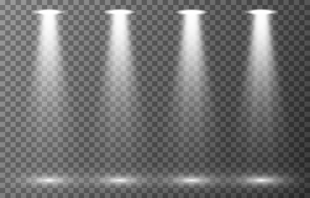 聚光灯设置在透明背景上。场景照明收集。逼真的明亮灯光效果图片下载