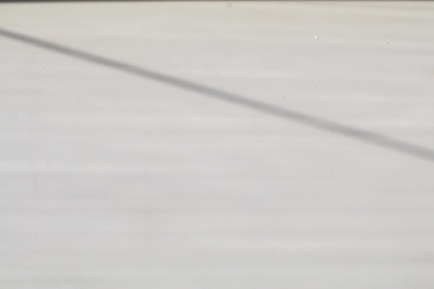 抽象的白色纹理背景和空灰色房间与阴影的窗户。用模糊背景显示产品。图片下载