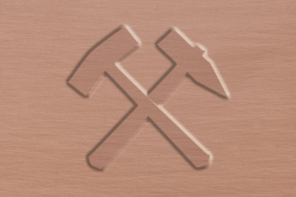 锤和镐在一个刷过的铜棒上图片下载