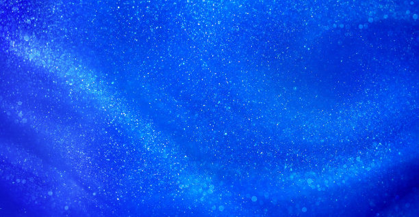 蓝色液体背景与小珠光发光粒子图片下载