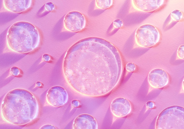 圆形透明滴透明凝胶血清在粉红色背景图片下载