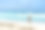 性感的年轻女子穿着黑色比基尼的后视图，拍摄热带海滩，大海和海浪的照片图片下载