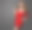 穿红色迷你裙的女人。穿着鸡尾酒会礼服的时装模特。快乐美丽吉尔与卷发和红唇妆在深灰色的背景图片下载