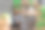 快乐的小精灵男子使用笔记本电脑和剪贴板坐在车间桌子上圣诞日。电子商务网站假日网上购物大甩卖图片下载