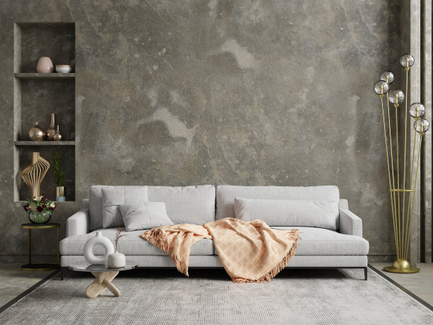 风格阁楼内部灰色沙发和装饰配件的深色水泥墙。图片下载