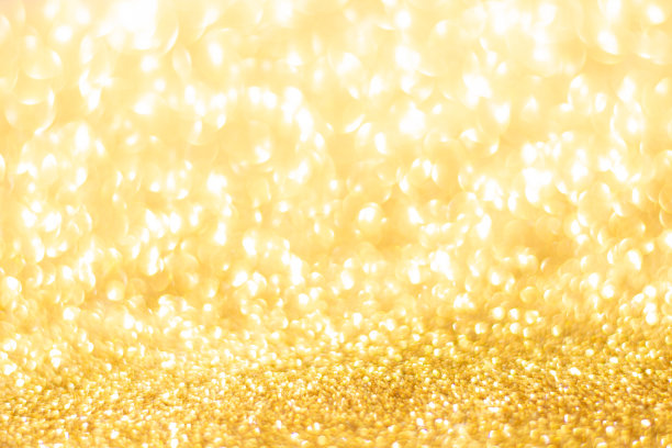 金色闪光散焦纹理背景。金色圣诞抽象背景图片下载