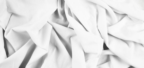 皱褶的白色织物，织物背景与褶皱。俯视图图片下载