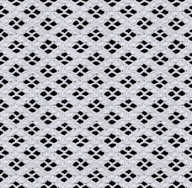 雪白的无缝针织纹理。漂亮的蕾丝与几何图案钩针。棉纱。图片下载