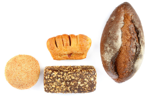 面包和甜糕点孤立在白色上。从上面看。文本的空闲空间。图片下载