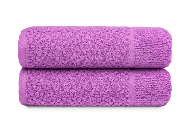 五颜六色的毛巾，卷起来堆在桌子上图片下载