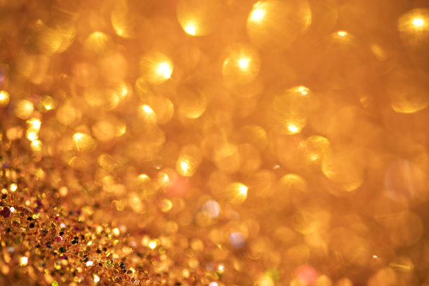 金色闪烁的灯光散景抽象背景假日图片下载