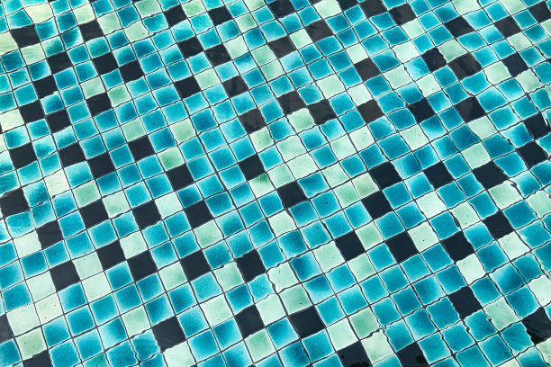 水波表面在游泳池为背景。图片下载