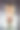 微笑的年轻女子与化妆和浴袍手持生日蛋糕与蜡烛。图片下载
