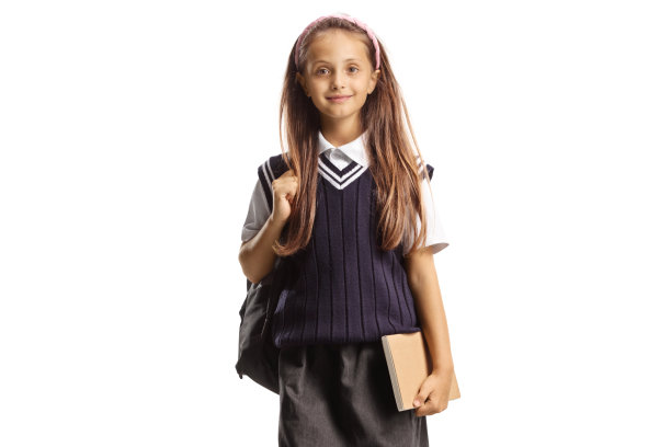 穿着校服的女孩背着背包和一本书图片下载