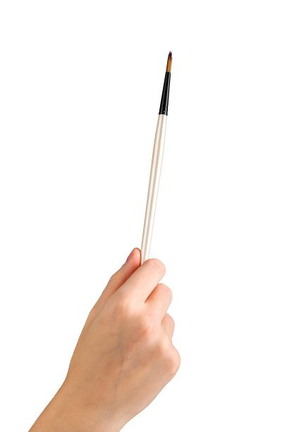 画笔，画笔在艺术家手中隔离在白色背景上图片下载