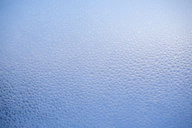 蓝色抽象背景。装饰玻璃的纹理、表面。图片下载