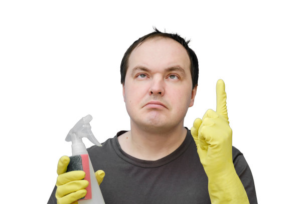 一个带着黄色手套的看门人有了一个想法，举起了他的食指，一幅孤立在白色背景下的画室里的肖像图片下载