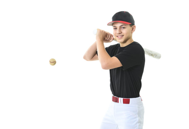 青少年棒球运动员工作室射击超过白色。图片下载
