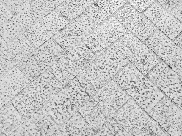 街道上的大理石地板，克罗地亚杜布罗夫尼克。长方形块的仿古砖瓦。黑白照片。大理石是一种由方解石CaCO3与其他矿物混合而成的变质岩石。图片下载