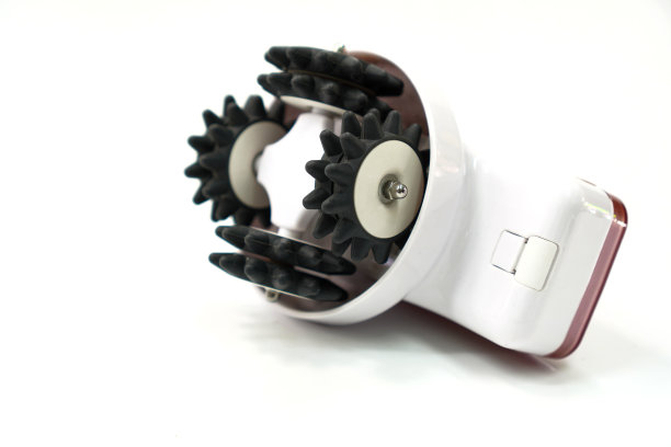 图为白色背景上使用电池供电系统的腹部和大腿瘦身按摩设备图片下载