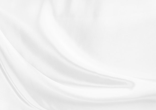 白色的灰色缎子的纹理是白色的银色织物真丝背景与美丽柔软的模糊图案自然。图片下载