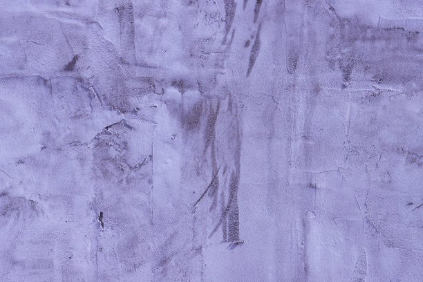 墙上不平整的蓝色灰泥碎片。图片下载