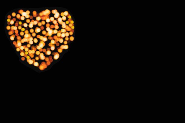 背景模糊的黄色灯在一个心形的形状上一个黑暗的复制空间图片下载