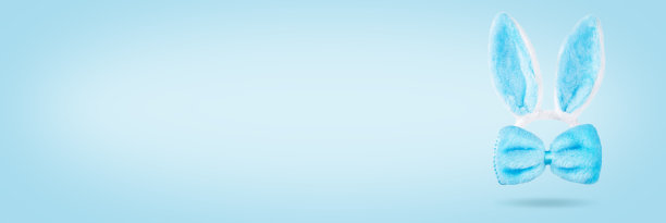 蓝色复活节背景兔耳朵和弓图片下载