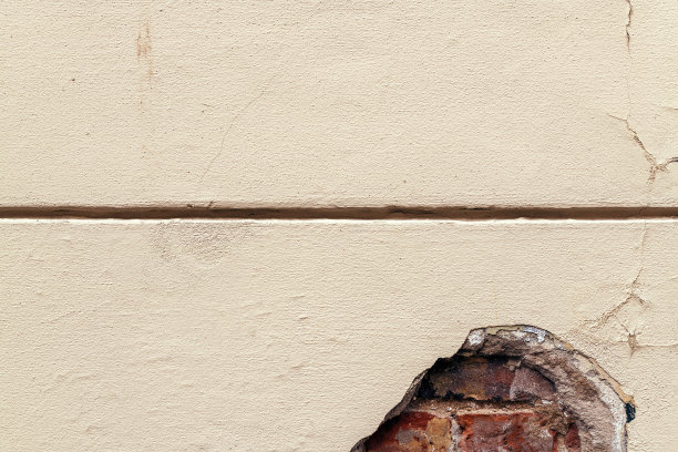 旧破损的水泥外墙砖墙作为背景图片下载