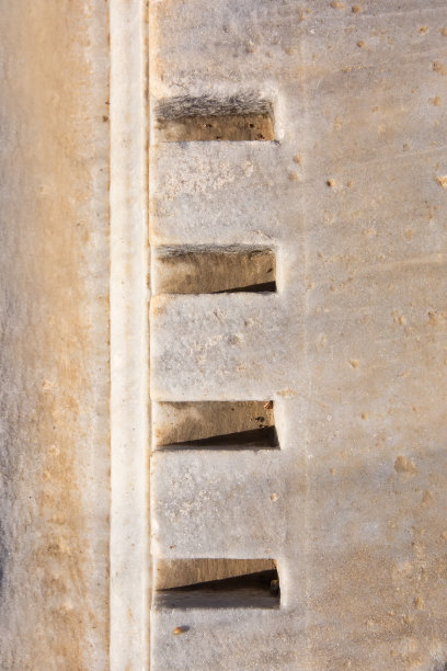 古老的背景。古希腊风格，卷曲的建筑元素，重复的图案。石灰岩。图片下载