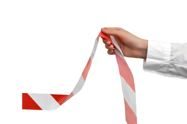 从办公室里取下限制带，隔离在白色背景上。结束与冠状病毒疫情隔离的概念图片下载