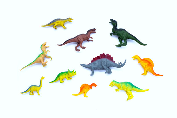 白色背景的塑料恐龙玩具。俯视图图片下载