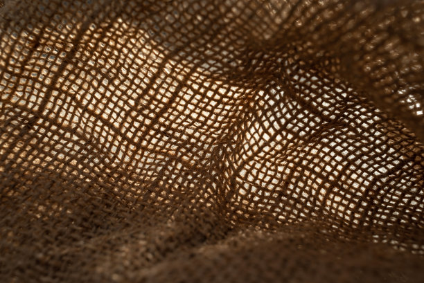 纹理为天然麻袋材质特写，带有天然褶皱和褶皱图片下载