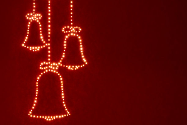 圣诞钟声概念贺卡与神秘的奇迹灯红色背景，美丽的艺术设计，复制空间图片下载