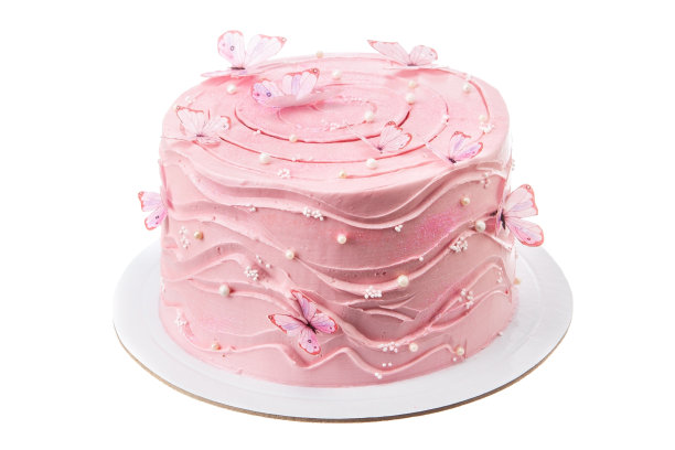 用华夫饼蝴蝶装饰的粉红奶油生日蛋糕。白色背景蛋糕。孤立。图片下载