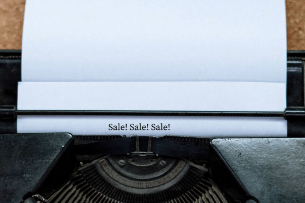 用传统打字机在白纸上打出销售字图片下载