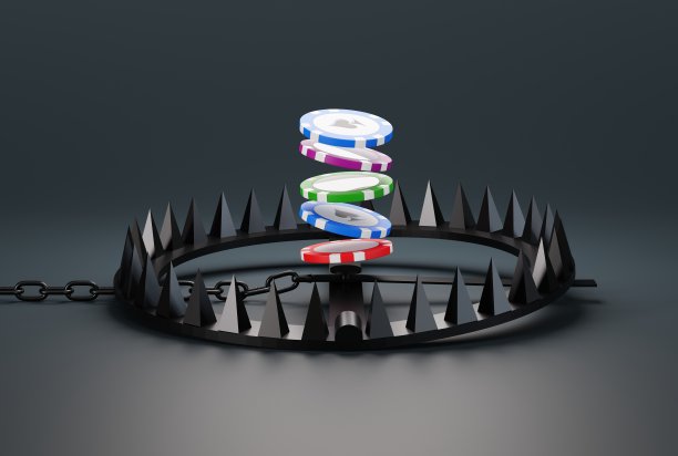 赌场筹码超过陷阱，陷阱在黑暗背景。图片下载