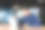 一个快乐的亚洲男人坐在办公室里，拿着笔记本电脑，视频通话，为成功而高兴图片下载