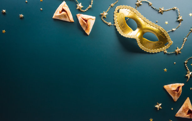 欢乐普林节嘉年华装饰概念，由金色面具星和亮片在黑暗的背景。(希伯来语普林节快乐，犹太人庆祝的节日)图片下载