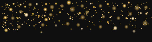 在黑色背景上模糊辉光效果。金色的辉光，喜庆的背景图片下载